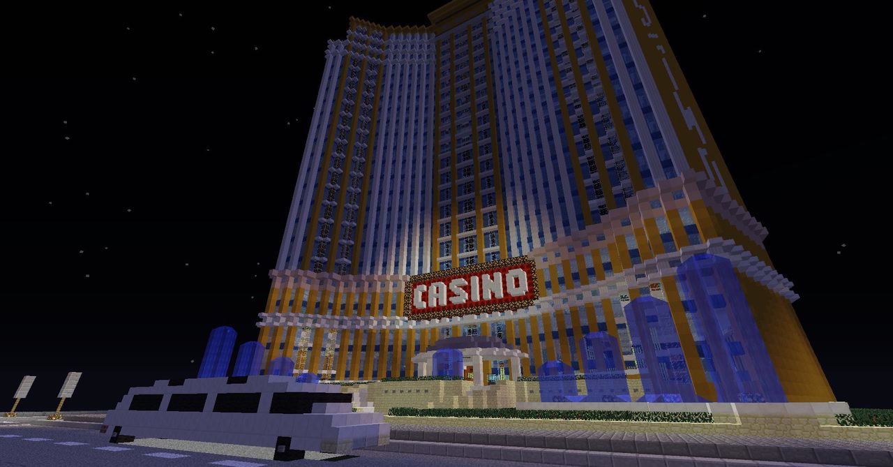 Das Casino-Hochhaus bei Nacht mit Leuchtschrift und Limousine